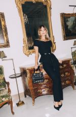 LILY JAMES at a Photoshoot, March 2025