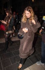 LILY JAMES Leaves an Elton John Concert in London 03/26/2025