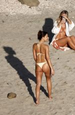 NATASHA OAKLEY and DEVIN BRUGMAN in Bikinis at a Beach in St Barts 03/20/2025