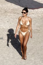 NATASHA OAKLEY and DEVIN BRUGMAN in Bikinis at a Beach in St Barts 03/20/2025