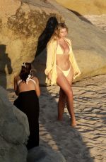 NATASHA OAKLEY and DEVIN BRUGMAN in Bikinis at a Beach in St Barts 03/20/2025