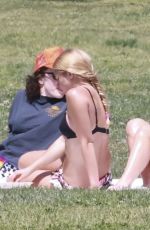 ADDISON RAE in a Cowgirl Hat and Mini Skirt and Tans in Bikini with Friends at Silver Lake Park 04/07/2025