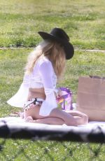 ADDISON RAE in a Cowgirl Hat and Mini Skirt and Tans in Bikini with Friends at Silver Lake Park 04/07/2025