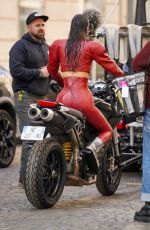 BELLA HADID in a Red Leather Satsuit Filming New Fashion Video in Paris 04/10/2025
