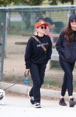 EMILY OSMENT on a stroll with Her Pup in Los Angeles 04/23/2025