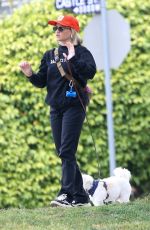 EMILY OSMENT on a stroll with Her Pup in Los Angeles 04/23/2025