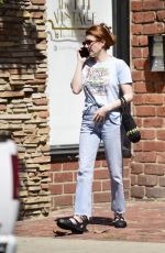 EMMA ROBERTS Shows off Her New Bright Red Locks Out in Los Angeles 04/10/2025