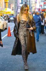 HEIDI KLUM in a Bold Leopard Print Catsuit and Leather Trench Coat Out in New York 04/23/2025