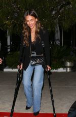 JESSICA ALBA Leaves on Crutches from The Bird Streets Club with a Friend in Los Angeles 04/15/2025