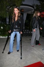 JESSICA ALBA Leaves on Crutches from The Bird Streets Club with a Friend in Los Angeles 04/15/2025