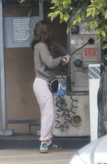 KATE MARA Checks Tire Pressure at a Gas Station in Los Angeles 04/28/2025
