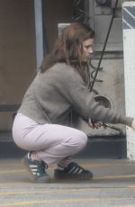 KATE MARA Checks Tire Pressure at a Gas Station in Los Angeles 04/28/2025