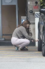 KATE MARA Checks Tire Pressure at a Gas Station in Los Angeles 04/28/2025