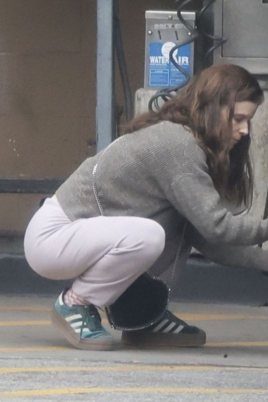 KATE MARA Checks Tire Pressure at a Gas Station in Los Angeles 04/28/2025