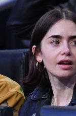 LILY COLLINS at NBA Game Between LA Lakers and Houston Rockets in Los Angeles 03/31/2025