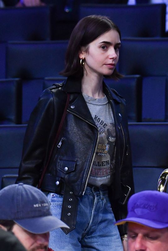 LILY COLLINS at NBA Game Between LA Lakers and Houston Rockets in Los Angeles 03/31/2025