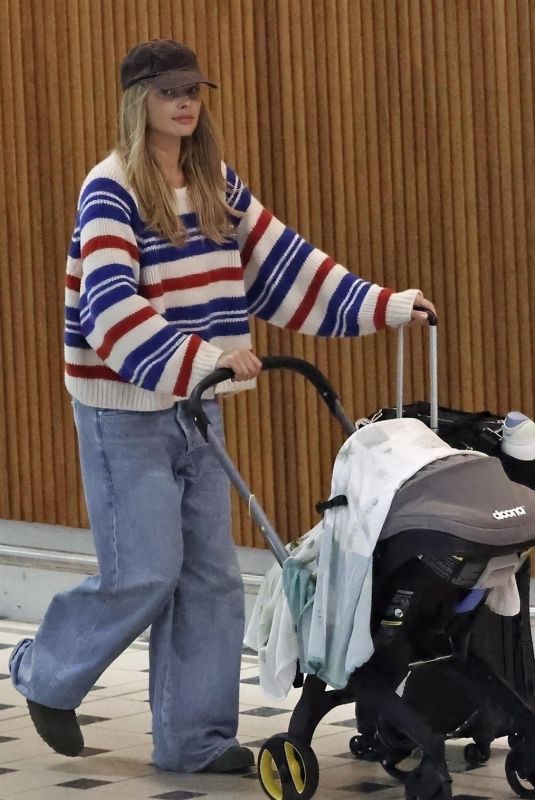 MARGOT ROBBIE Arrives at Brisbane Airport in Australia 04/15/2025