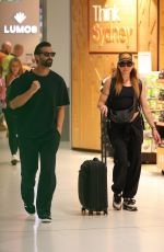 MELANIE CHISHOLM and Chris Dingwall Departing Sydney Airport 04/14/2025