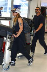 MELANIE CHISHOLM and Chris Dingwall Departing Sydney Airport 04/14/2025
