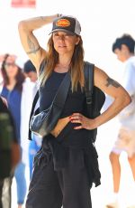 MELANIE CHISHOLM and Chris Dingwall Departing Sydney Airport 04/14/2025