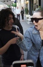 MILEY CYRUS Signing Autographs and Posing for Photos in Paris 04/27/2025