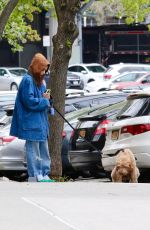 RACHEL ZEGLER Out with Her Dog in New York City 04/21/2025