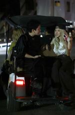 ROSE Shares a Laugh with a Friend on Golf Cart After Coachella 04/13/2025