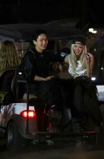 ROSE Shares a Laugh with a Friend on Golf Cart After Coachella 04/13/2025