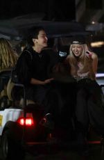 ROSE Shares a Laugh with a Friend on Golf Cart After Coachella 04/13/2025