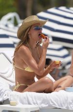 BROOKS NADER in a Yellow Bikini to the Beach in Miami 05/07/2025