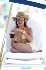 BROOKS NADER in a Yellow Bikini to the Beach in Miami 05/07/2025