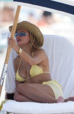 BROOKS NADER in a Yellow Bikini to the Beach in Miami 05/07/2025