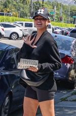 CHRISSY TEIGEN in Tight Shorts Out in Los Angeles 05/20/2025