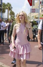ELLE FANNING in a Chanel Dress Out on Croisette in Cannes 05/21/2025