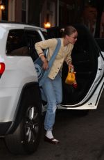 GIGI HADID Heading to a Friend