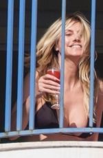 HAIDI KLUM in Bikini on the Balcony of Martinez Hotel in Cannes 05/11/2025