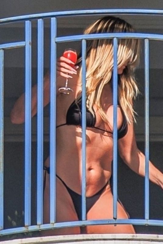 HAIDI KLUM in Bikini on the Balcony of Martinez Hotel in Cannes 05/11/2025