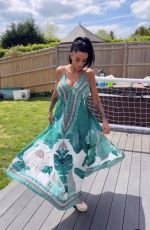 KATIE PRICE Models Her New Maxi Dress from JYY London Brand Collection 05/26/2025