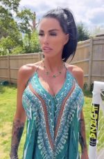 KATIE PRICE Models Her New Maxi Dress from JYY London Brand Collection 05/26/2025