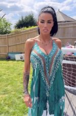 KATIE PRICE Models Her New Maxi Dress from JYY London Brand Collection 05/26/2025