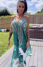 KATIE PRICE Models Her New Maxi Dress from JYY London Brand Collection 05/26/2025