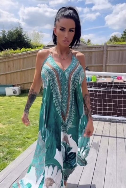KATIE PRICE Models Her New Maxi Dress from JYY London Brand Collection 05/26/2025