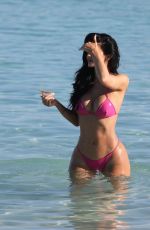 KYLIE JENNER in a Neon Pink Bikini on the Beach in Turks and Caicos 05/10/2025