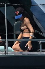 KYLIE JENNER in Bikini on Yacht at F1 Weekend with Hailey Bieber and Friends in Miami 05/02/2025