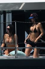 KYLIE JENNER in Bikini on Yacht at F1 Weekend with Hailey Bieber and Friends in Miami 05/02/2025