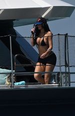 KYLIE JENNER in Bikini on Yacht at F1 Weekend with Hailey Bieber and Friends in Miami 05/02/2025