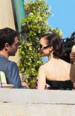 LILY COLLIN Shoots a Romantic Scene with Eugenio Franceschini on the Set of Emily in Paris 05/19/2025