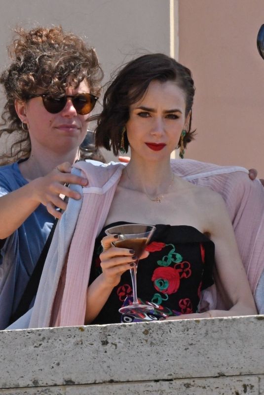 LILY COLLIN Shoots a Romantic Scene with Eugenio Franceschini on the Set of Emily in Paris 05/19/2025