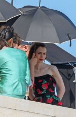 LILY COLLIN Shoots a Romantic Scene with Eugenio Franceschini on the Set of Emily in Paris 05/19/2025