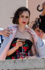 LILY COLLIN Shoots a Romantic Scene with Eugenio Franceschini on the Set of Emily in Paris 05/19/2025